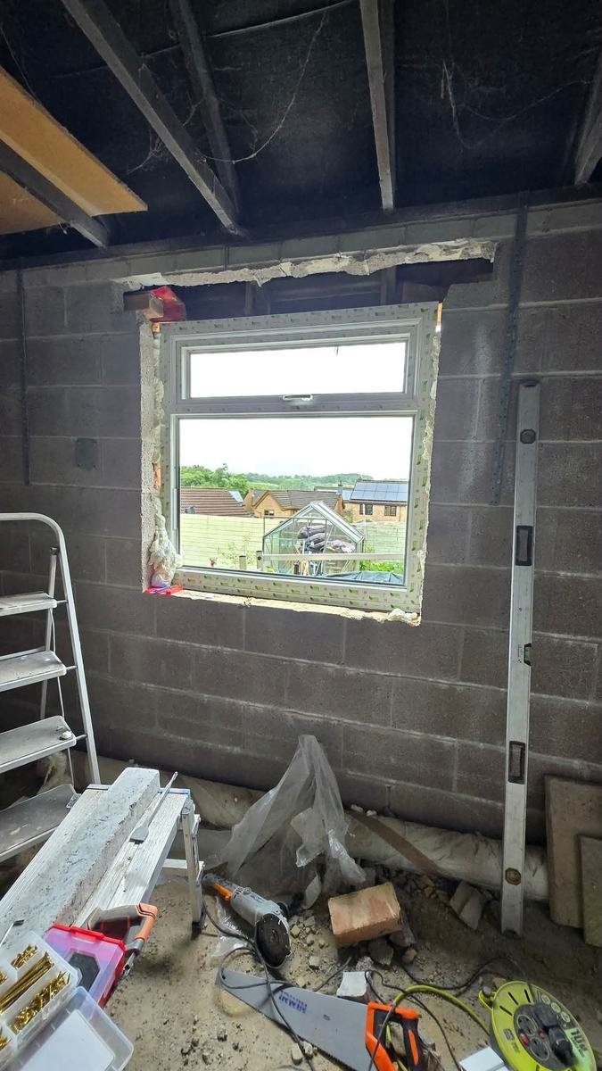 Feature wall stud framing for a media wall and fireplace